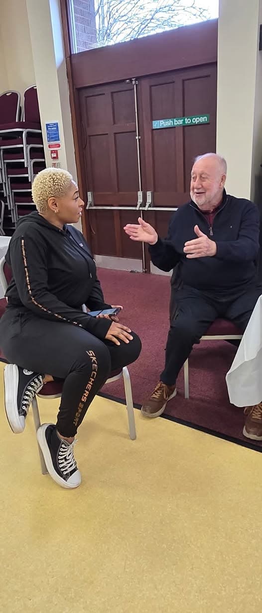 Two people chatting at our Miners Pit Talk, Kingston Road Community Hub